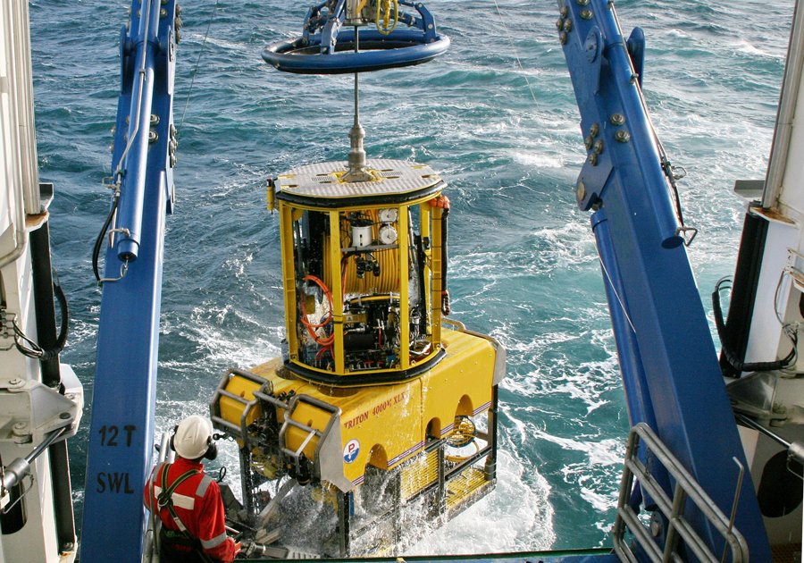 ROV being lifted on to the back of a boat